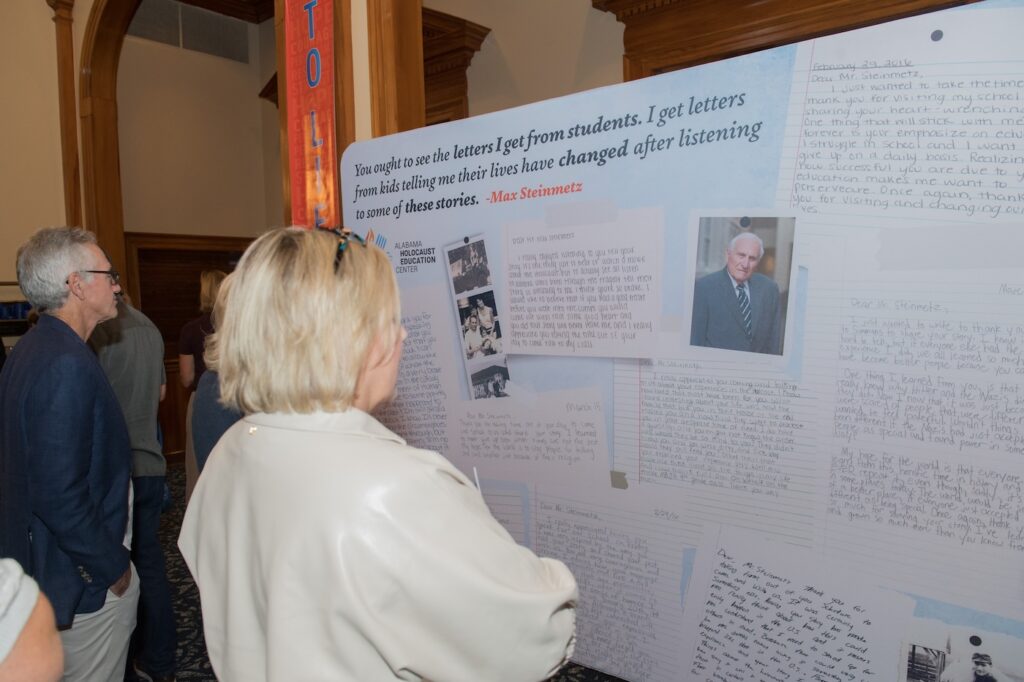 Visitors looking at documents on graphics