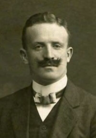 Man with mustache wearing bowtie